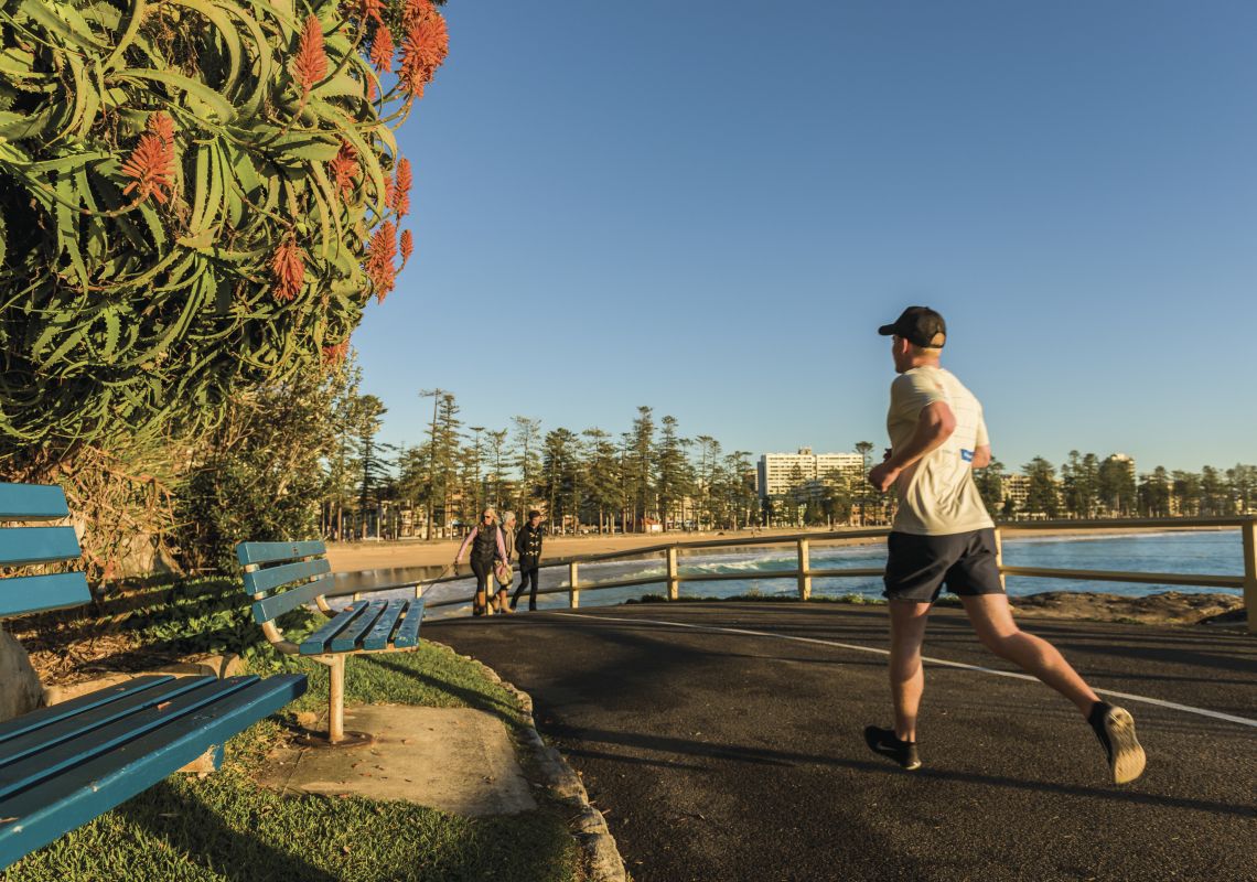 Man jogging by Manly Beach in Manly, Sydney North