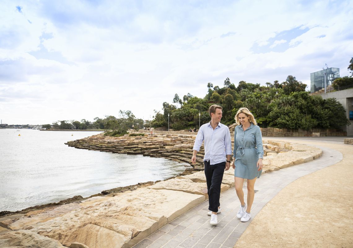 Couple enjoying a walk around Nawi Cove in Barangaroo, Sydney City