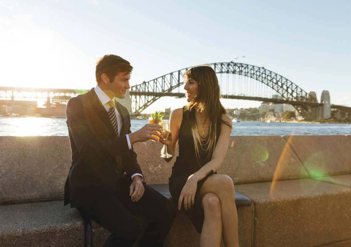 Opera Bar, Sydney Harbour Couple enjoying drinks at sunset by Sydney Harbour, Sydney City