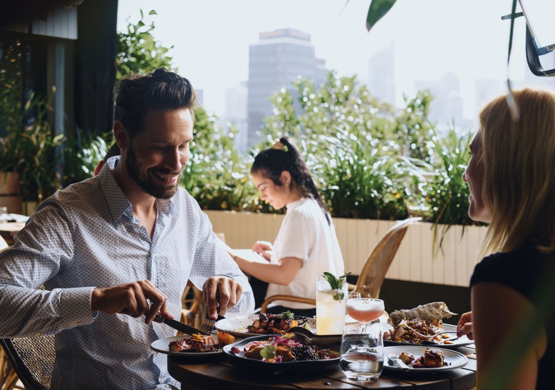 The Butler, Potts Point Couple enjoying food and drink at The Butler, an open patio bar located on Victoria Street in Potts Point, Sydney City