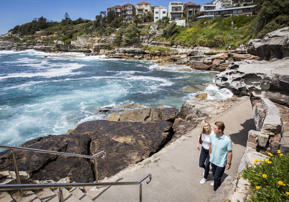 Couple enjoying the scenic Bondi to Bronte coastal walk in Bondi , Sydney East