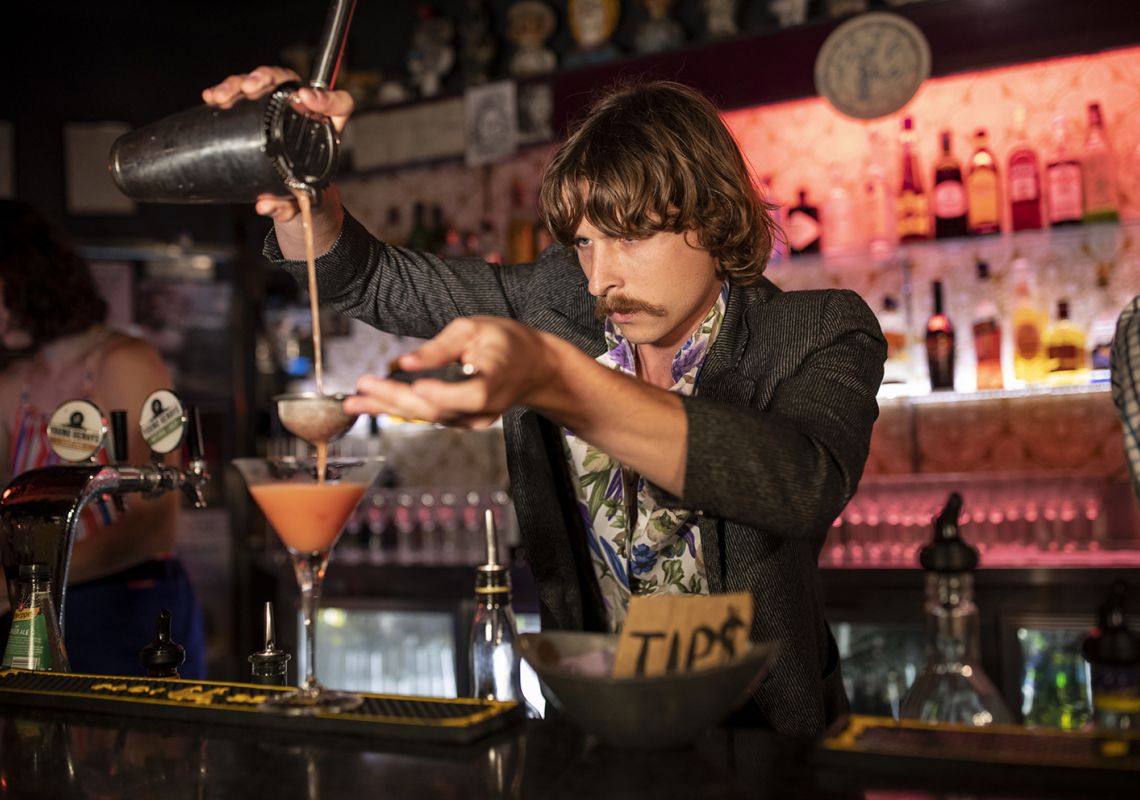 Bartender creating a cocktail at the Camelot Lounge in Marrickville,  Inner Sydney