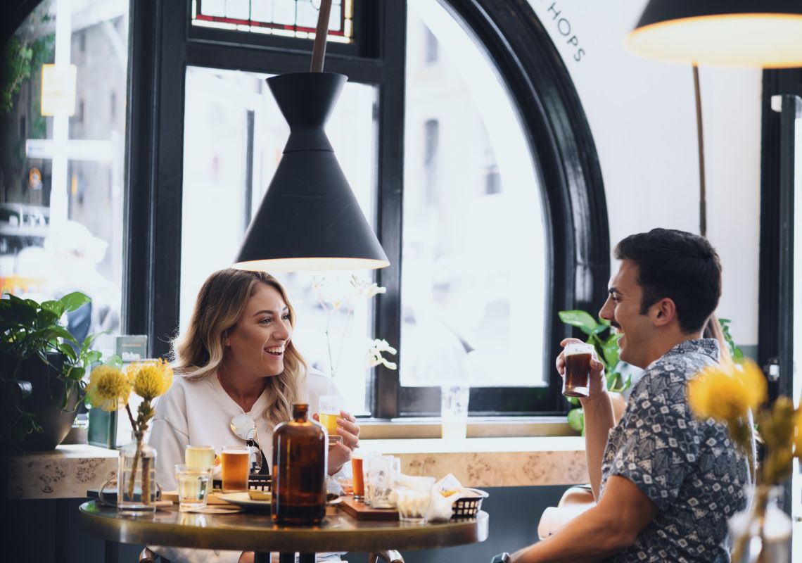 Endeavour Tap Rooms, The Rocks Couple enjoying food and drinks at the Endeavour Tap Rooms in The Rocks, Sydney City