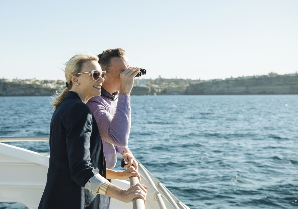 Whale Watching, Sydney Couple watching out for whales aboard a Captain Cook Cruises cruise vessel off Sydney Heads, Sydney Harbour
