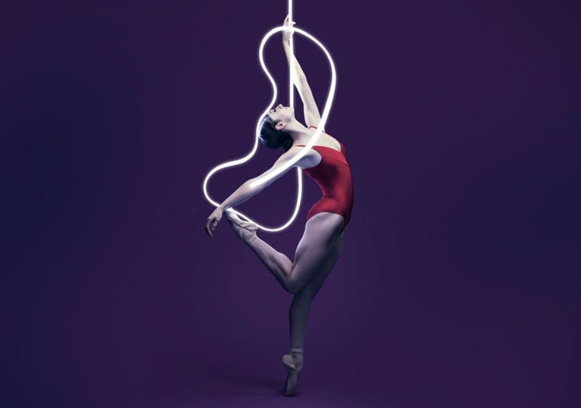 The Australian Ballet presents Volt A woman stands in a balletic position, The Australian Ballet presents Volt