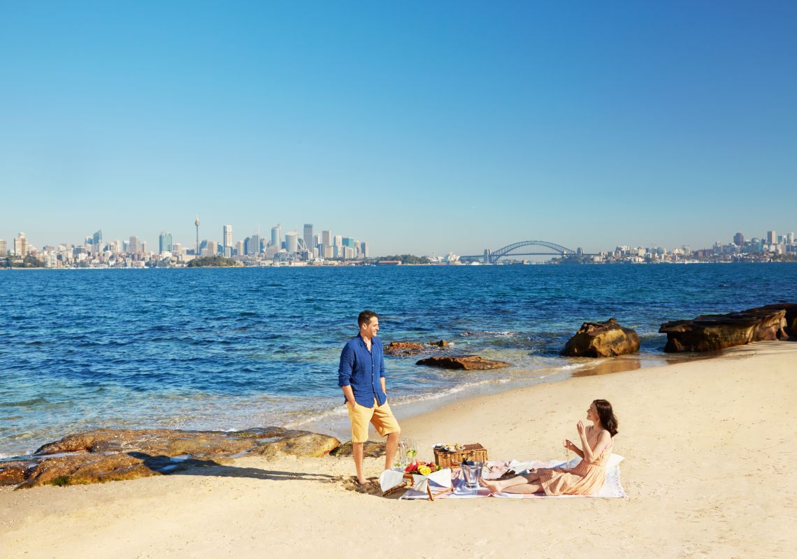 Shark Island, Sydney Harbour Couple enjoying a picnic with harbour views on Shark Island, Sydney Harbour