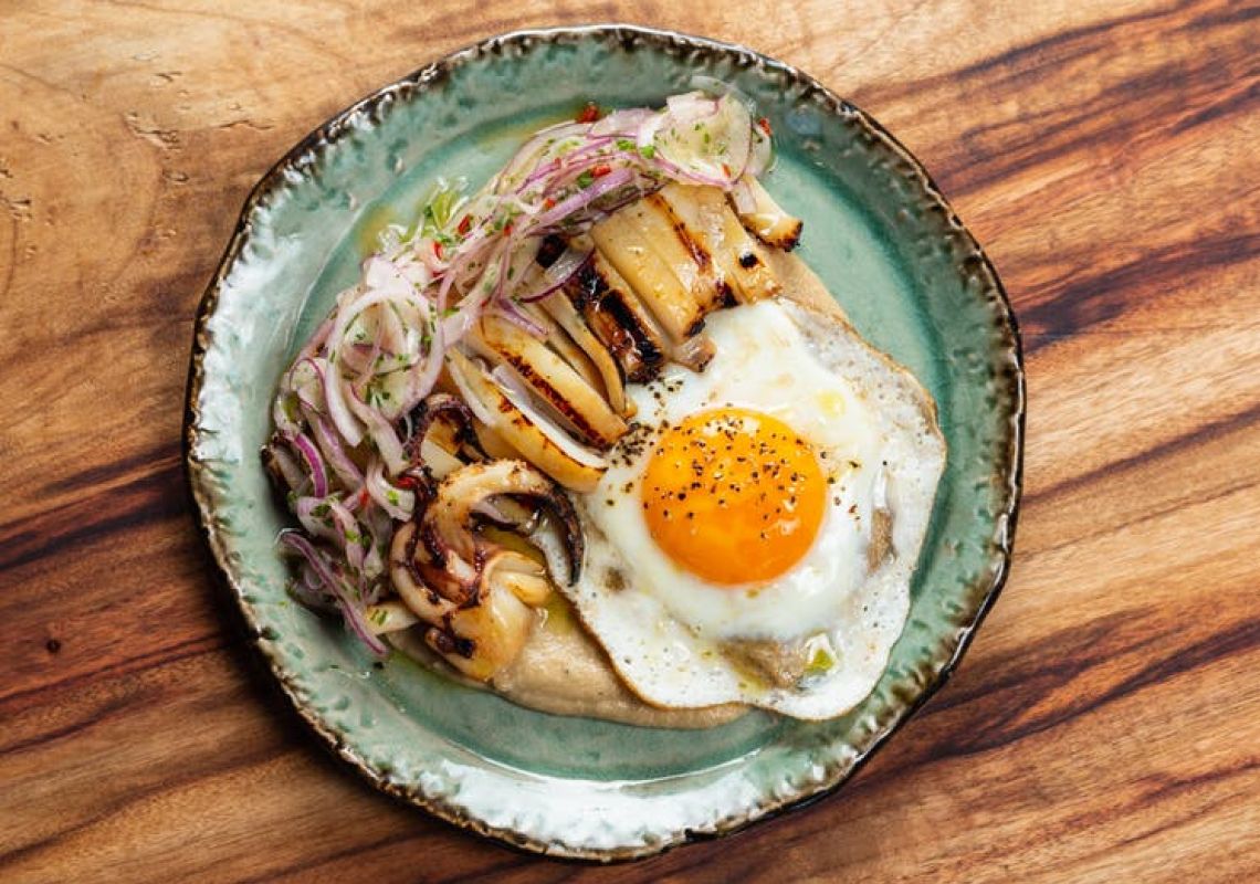 Nikkei Bar and Restaurant, Surry Hills Southern calamari, roasted banana, salsa criolla, fried egg at Nikkei Bar and Restaurant