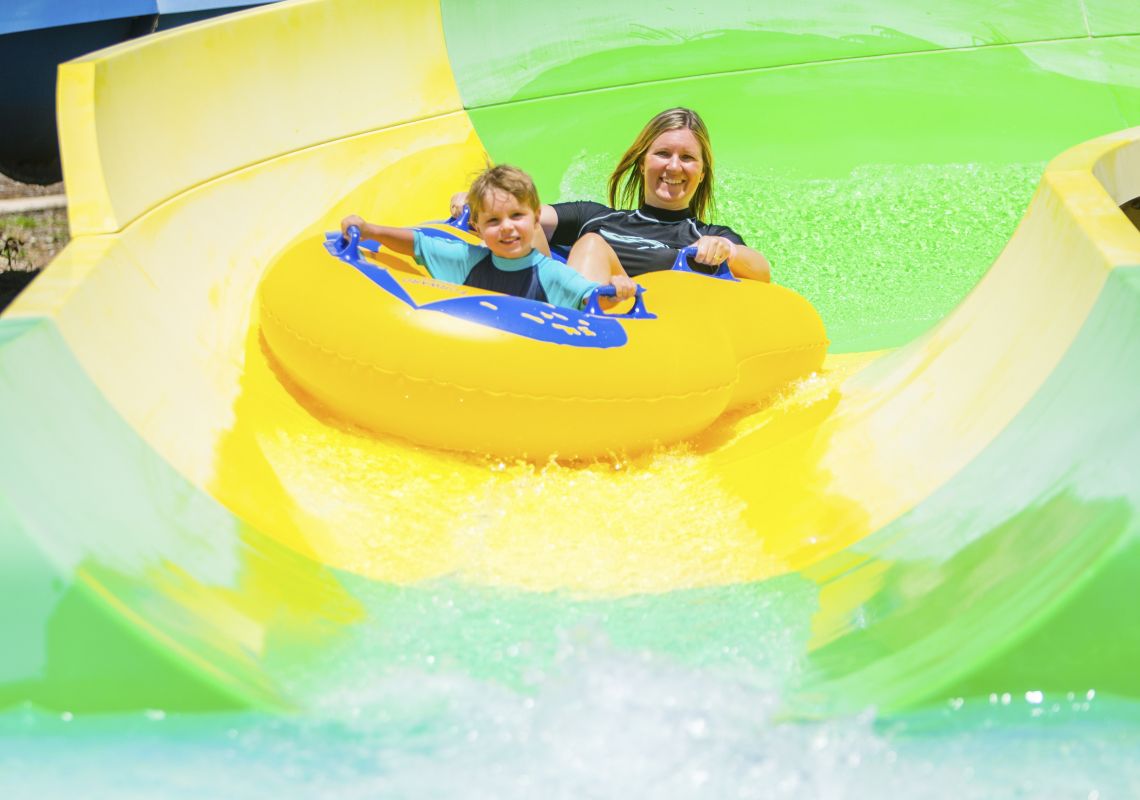 Raging Waters Sydney, Prospect Mother and son enjoying a ride at Raging Waters Sydney in Blacktown, Sydney west