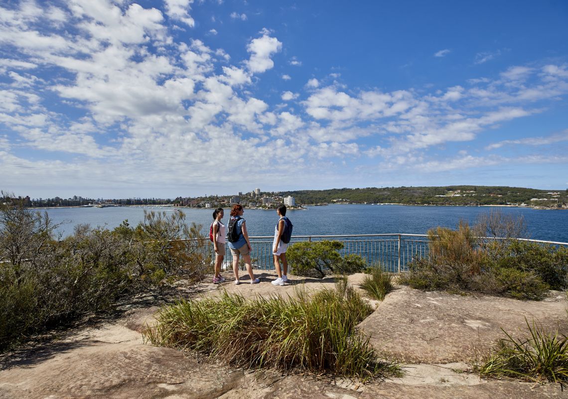 Friends enjoying stunning coastal views of Sydney Harbour from Dobroyd Head, Balgowlah Heights.