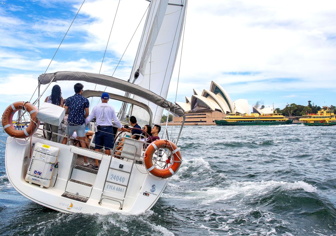 People enjoying a chartered sailing tour on Sydney Harbour