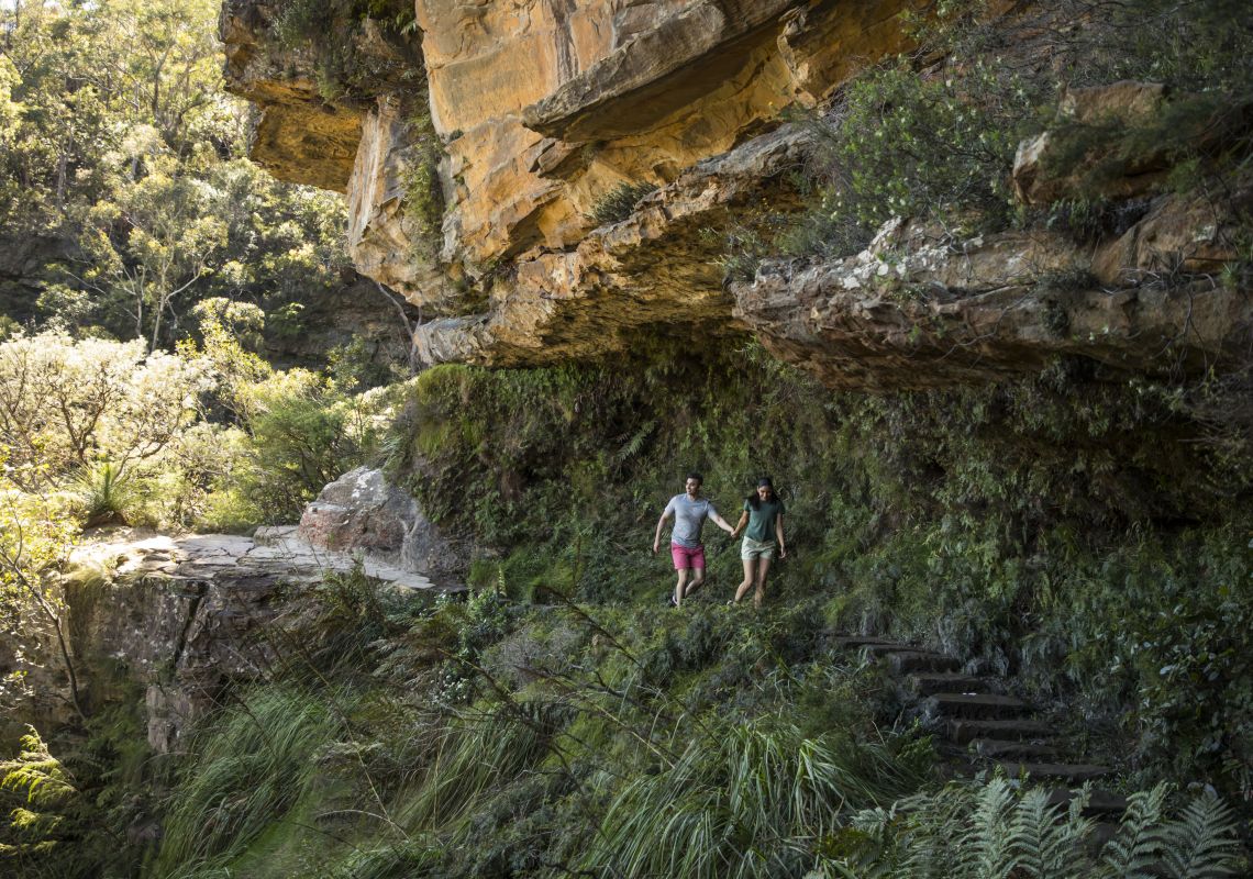 Couple enjoying a walk along the Wentworth Falls Track in the Blue Mountains National Park