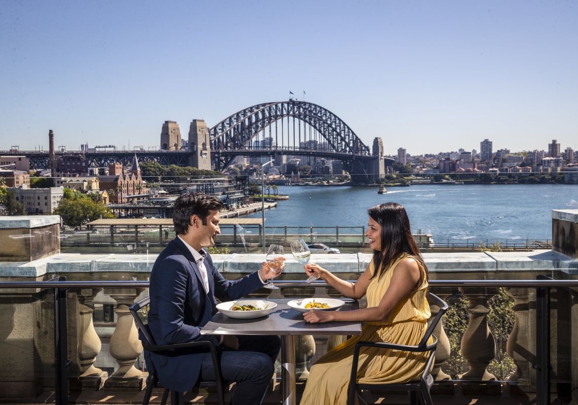 Cafe Sydney, Sydney Couple enjoying food and drink with harbour views at Cafe Sydney, Sydney