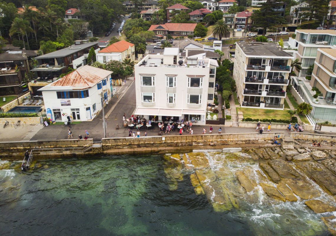 Aerial overlooking The Bower Manly restaurant and the Cabbage Tree Bay Aquatic Reserve, Manly