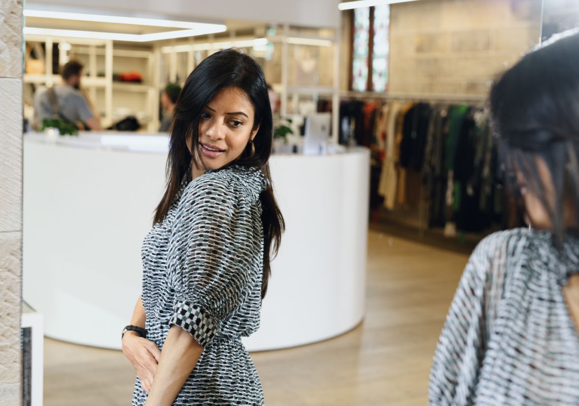Woman browsing designer labels at the Parlour X fashion boutique on Oxford Street in Paddington, Sydney City