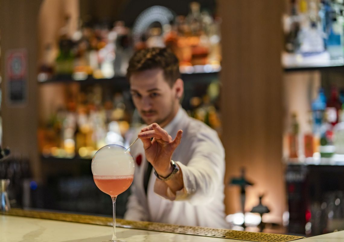 Maybe Sammy, The Rocks Bartender creating a cocktail at Maybe Sammy cocktail bar in The Rocks, Sydney City