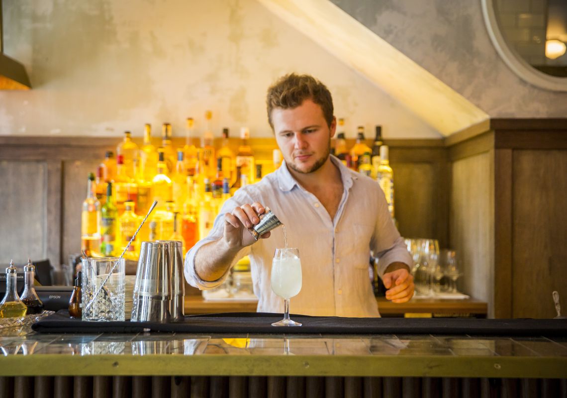 The Paddington Pub, Inner Sydney Bartender pouring a cocktail at The Paddington Pub in Paddington, Inner Sydney