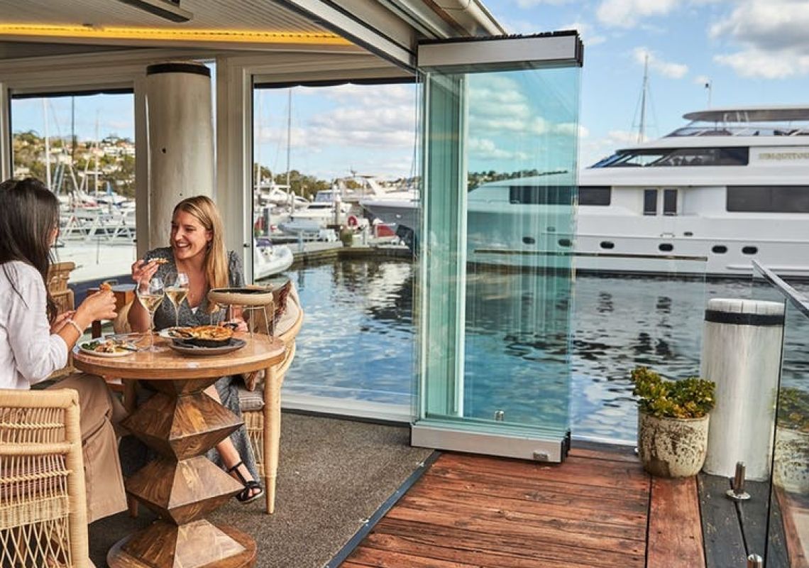 Guests seating in deck area, Ormeggio at The Spit Italian seafood restaurant in Mosman, Sydney North