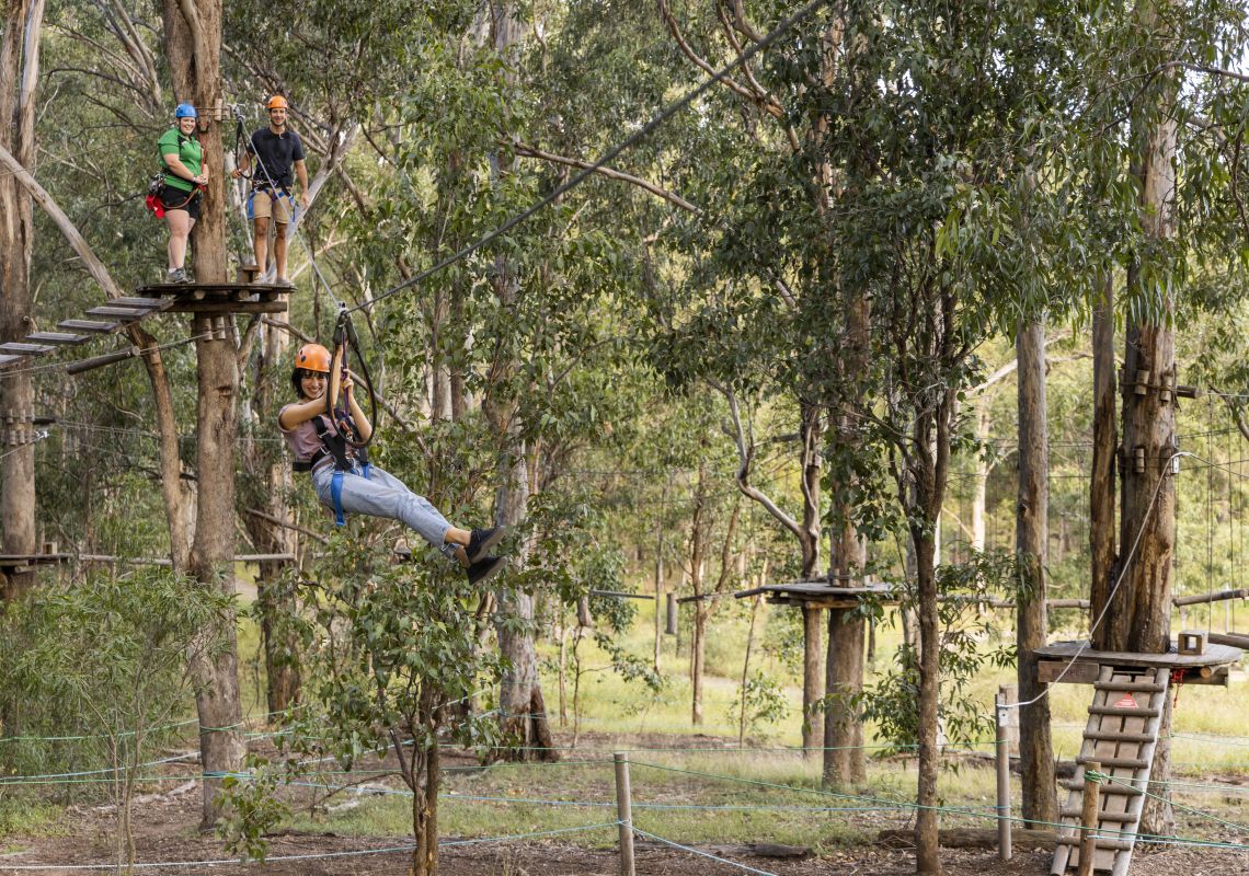 Woman enjoying the action at TreeTops Adventure Park, Abbotsbury in Sydney's south west