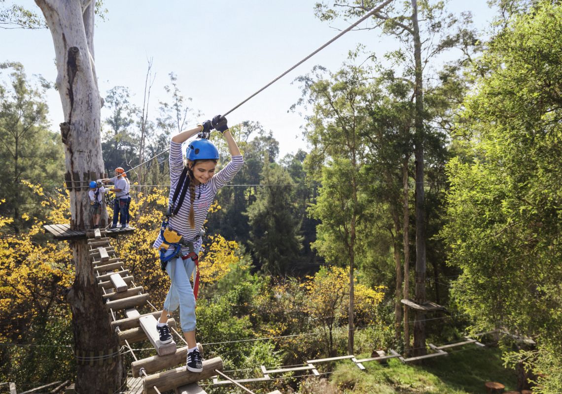 Girl enjoying a day on the ropes course with her family at Trees Adventure, Yarramundi