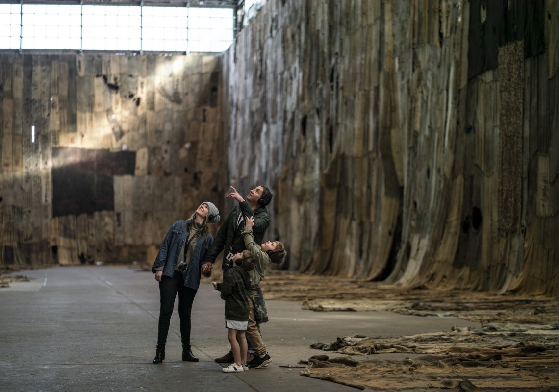 Family enjoying a self-guided audio tour on Cockatoo Island in Sydney Harbour