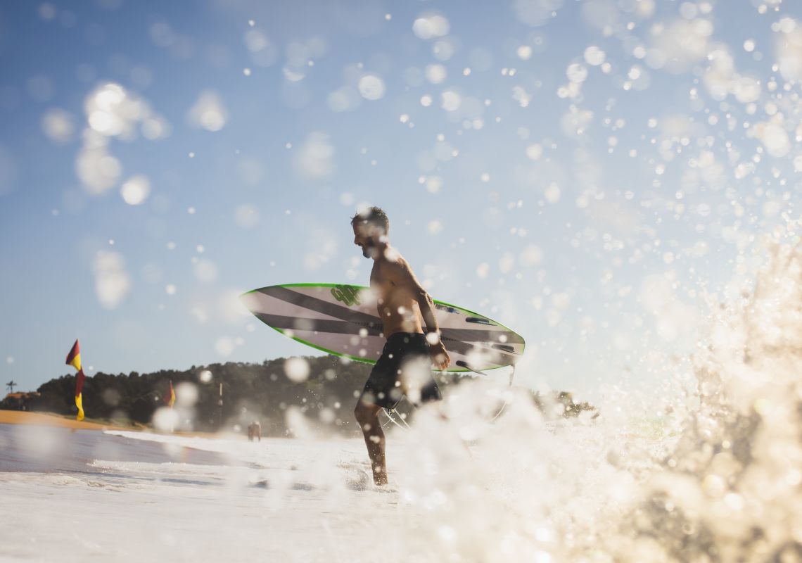 Man enjoying the surf at North Narrabeen Beach, North Narrabeen