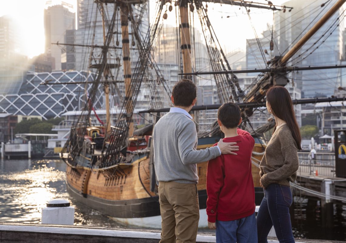 Family exploring the HMB Endeavour, an Australian-built replica of James Cook's ship on exhibit at the Australian National Maritime Museum, Darling Harbour
