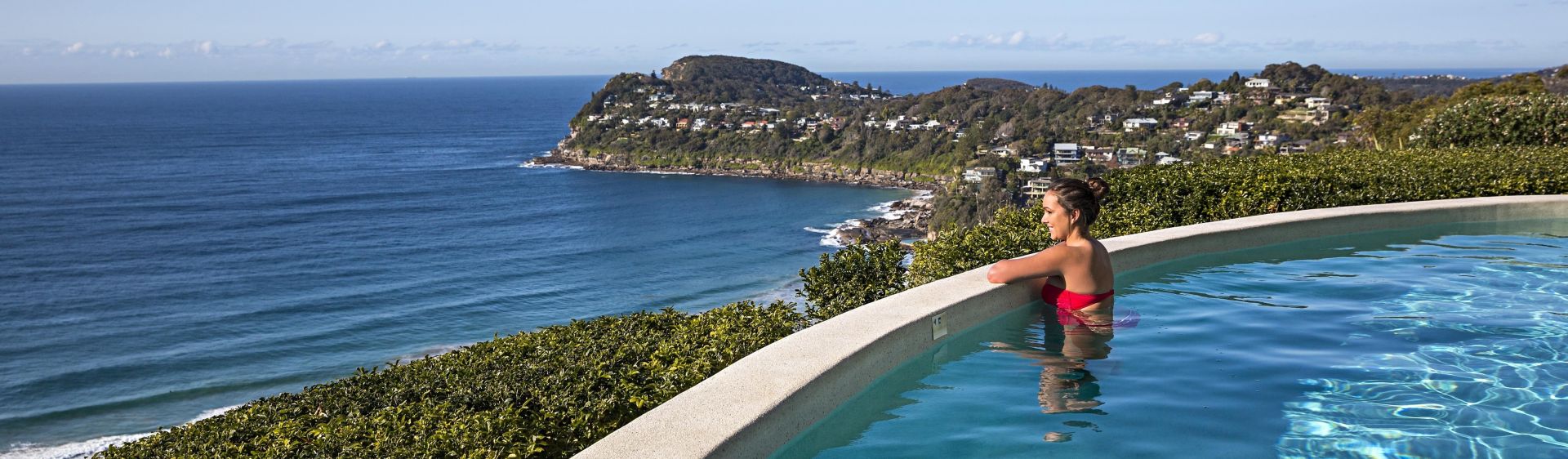 Woman enjoying ocean views from Jonah's on Whale Beach Jonah's, Whale Beach