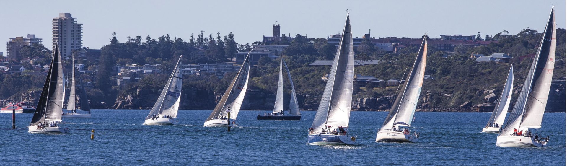 Sail boats passing through Sydney Harbour on a sunny day Sailing, Sydney Harbour