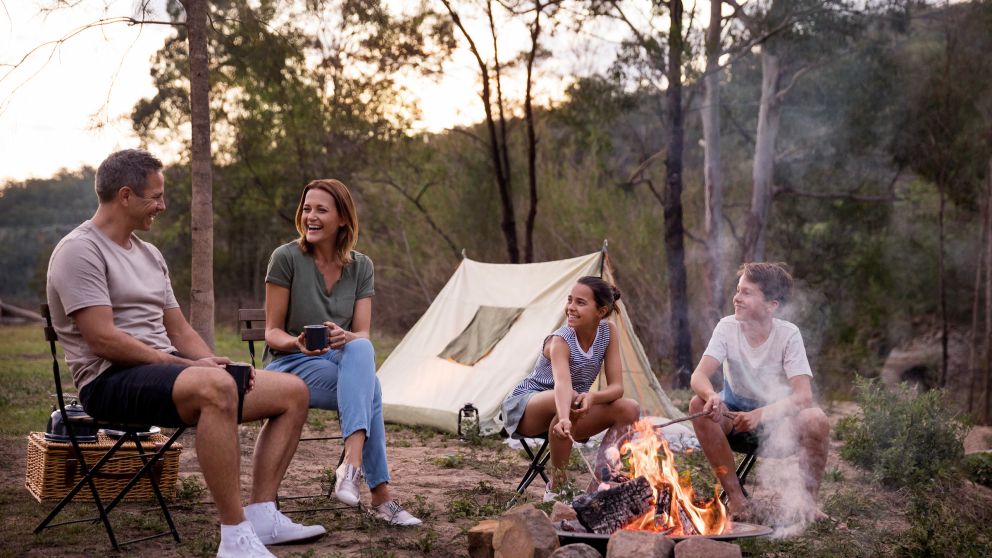 Children enjoying a campfire by their tent on the Hawkesbury River in Lower MacDonald