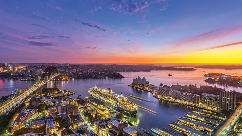 Aerial over Circular Quay and Sydney Icons at Sunrise