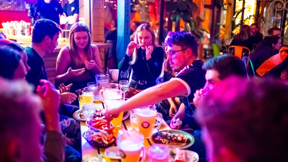 Friends enjoying the food and drink at Norfolk Hotel in Redfern, Inner Sydney