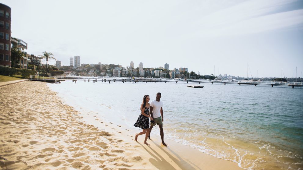 Couple enjoying a walk by Murray Rose Pool, Double Bay