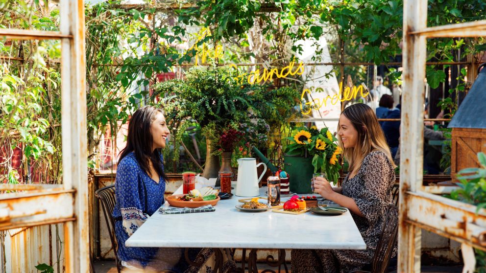 Friends enjoying breakfast and morning tea at the Grounds of Alexandria in Alexandria, Sydney