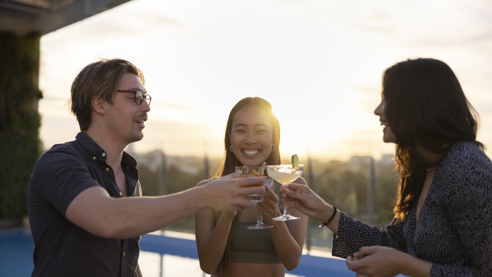 Friends enjoying drinks at sunset at The William Inglis Hotel, Warwick Farm in Sydney's south west