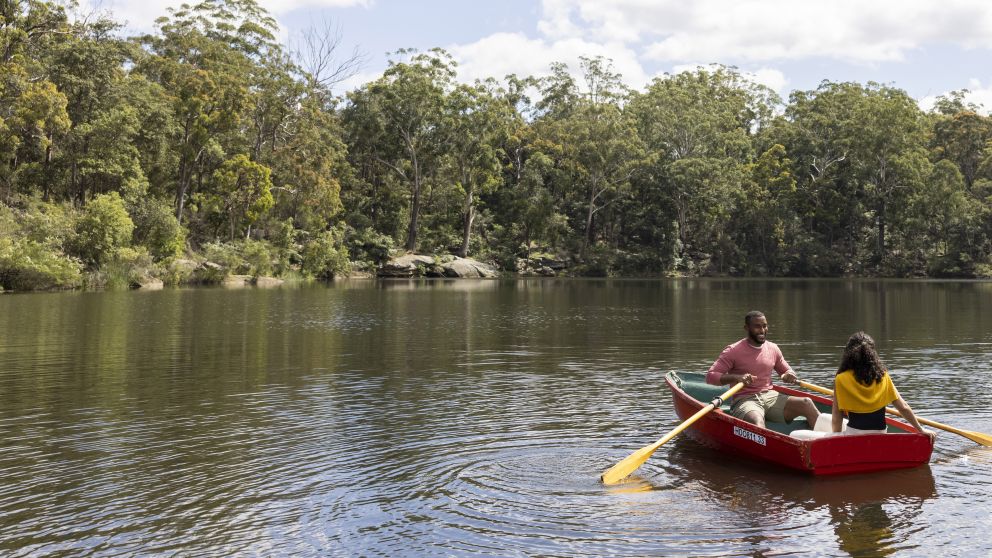 Couple enjoying a day out on Hunts Creek, Parramatta with Parramatta Rowboats