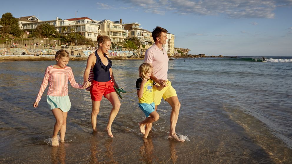A family walking on north Bondi beach, Sydney East