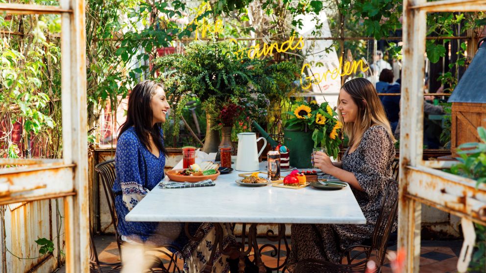 Friends enjoying breakfast and morning tea at the Grounds of Alexandria in Alexandria, Sydney