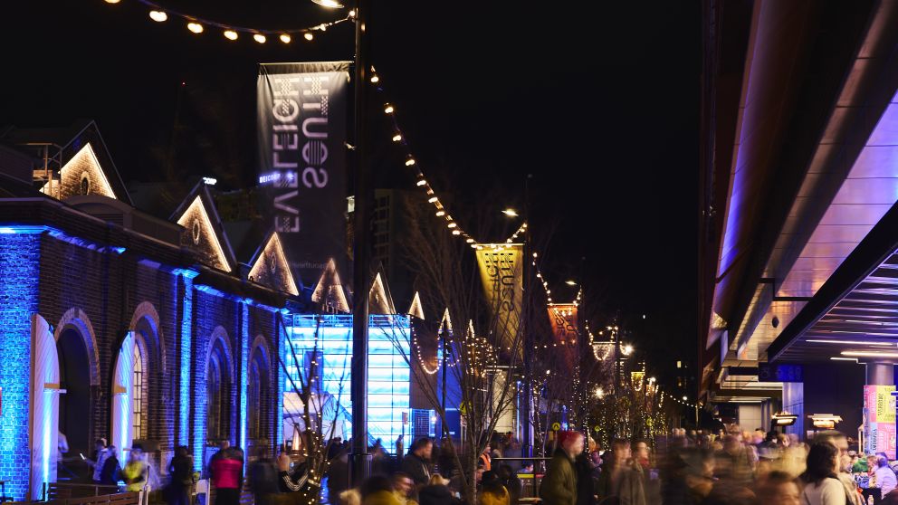 Attendees enjoying a night out at the South Eveleigh Solstice Festival, South Eveleigh