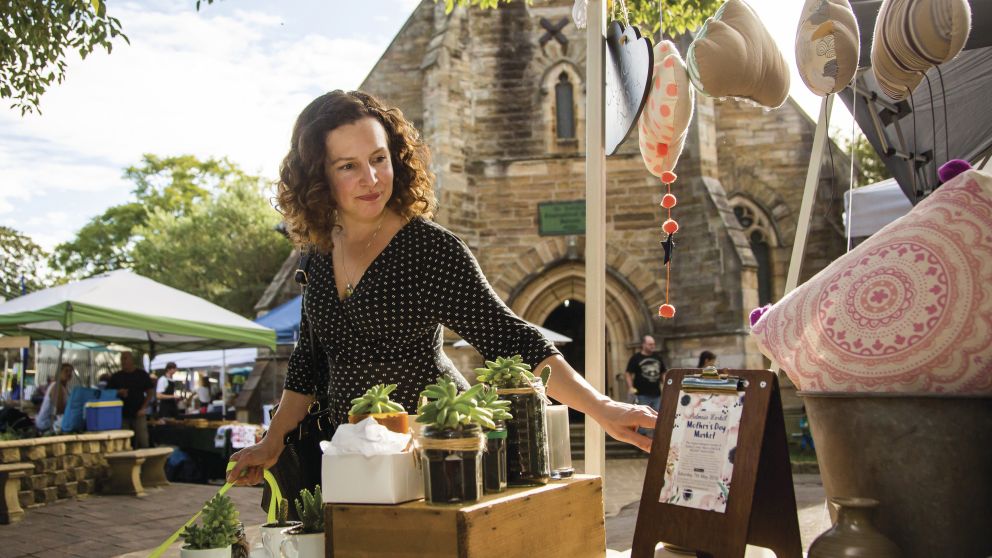 Woman browsing homewares at Balmain Markets, Sydney's third-oldest markets, Balmain