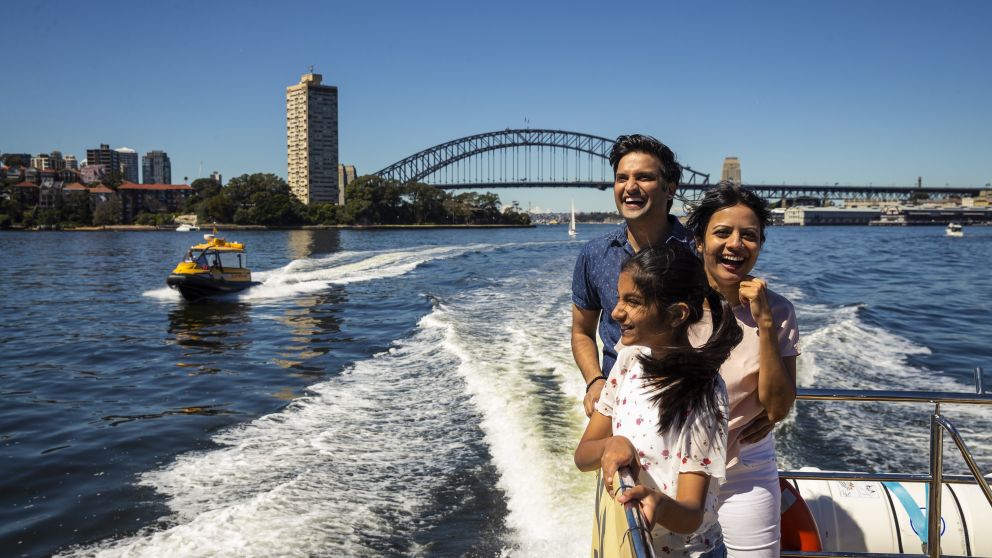 Family enjoying harbour views aboard the Shopper Hopper ferry service to Birkenhead Point Brand Outlet centre