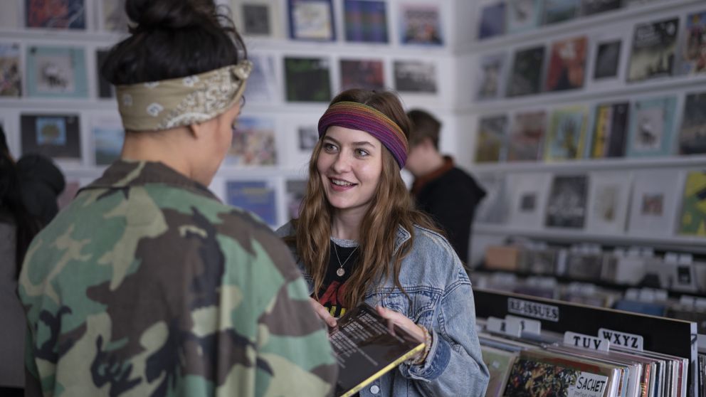 Couple browsing records at Repressed Records, Newtown.