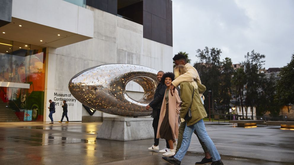 Friends arriving outside the Museum of Contemporary Art Australia in The Rocks, Sydney City