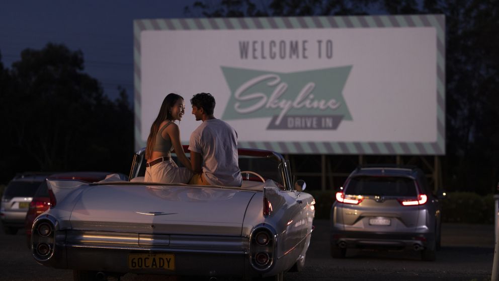 Couple sitting in their car ready to watch a movie at the Skyline Drive In Blacktown