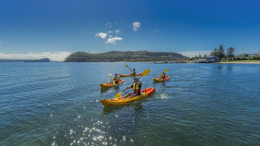 Friends kayaking on Pittwater near Boathouse Restaurant and Palm Beach Lighthouse