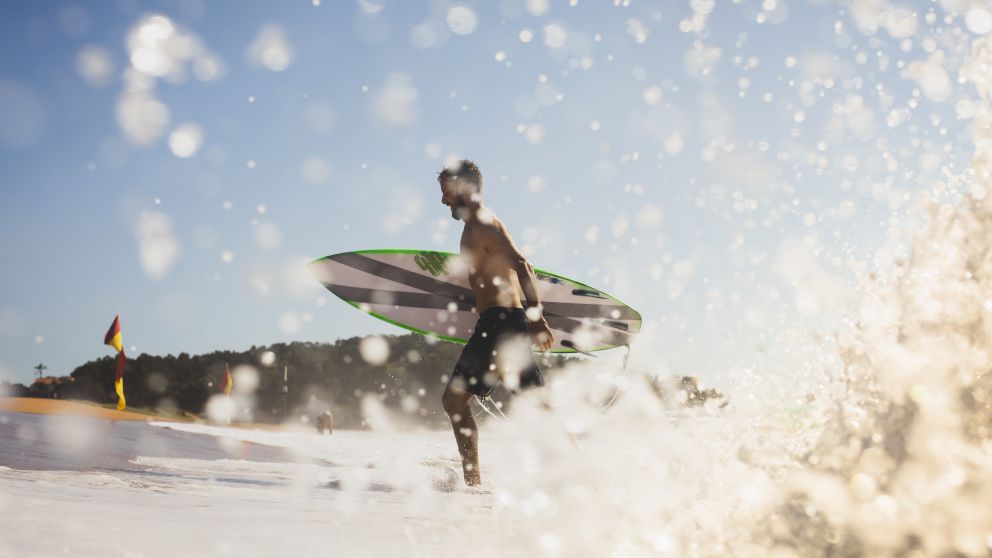 Man enjoying the surf at North Narrabeen Beach, North Narrabeen