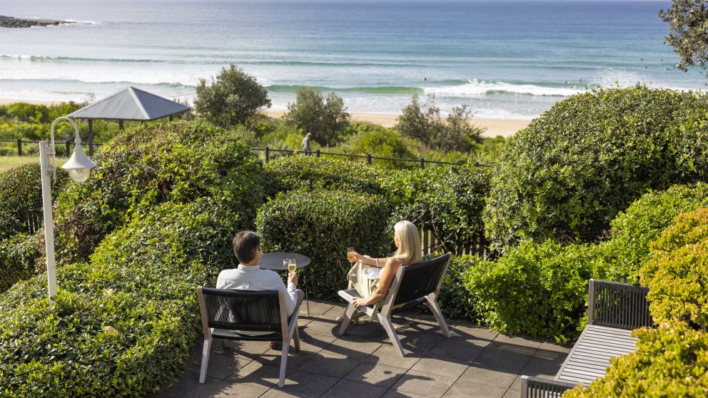 Couple enjoying a glass of champagne at Pilu at Freshwater in the Northern Beaches of Sydney