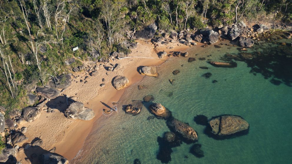 Man enjoying a morning walk along West Head Beach in Ku-ring-gai National Park