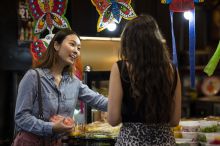 Friends buying Thai street food style desserts from Thanon Khaosan restaurant in Haymarket, Sydney City