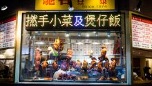 BBQ and roasted duck hanging in a restaurant window, Chinatown