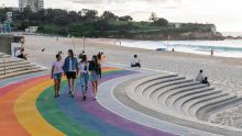 Couples walking along the rainbow staircase at Coogee Beach Couples walking along the rainbow staircase at Coogee Beach
